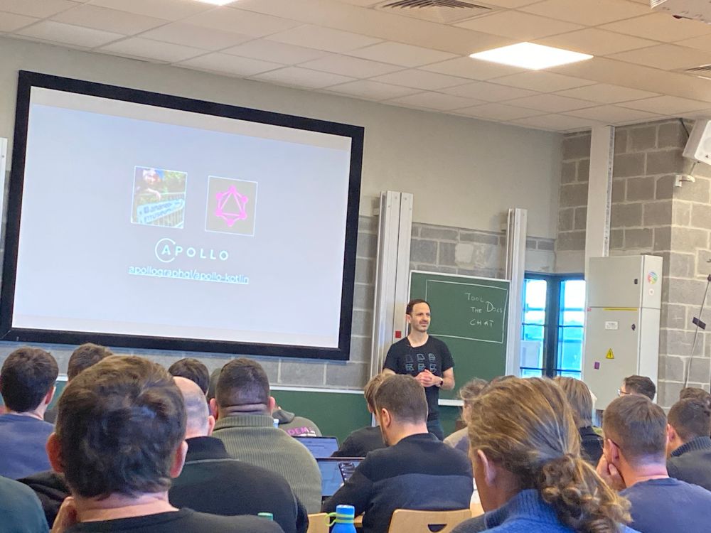 Martin is presenting his talk at FOSDEM. The slide shows his love of bananas and GraphQL