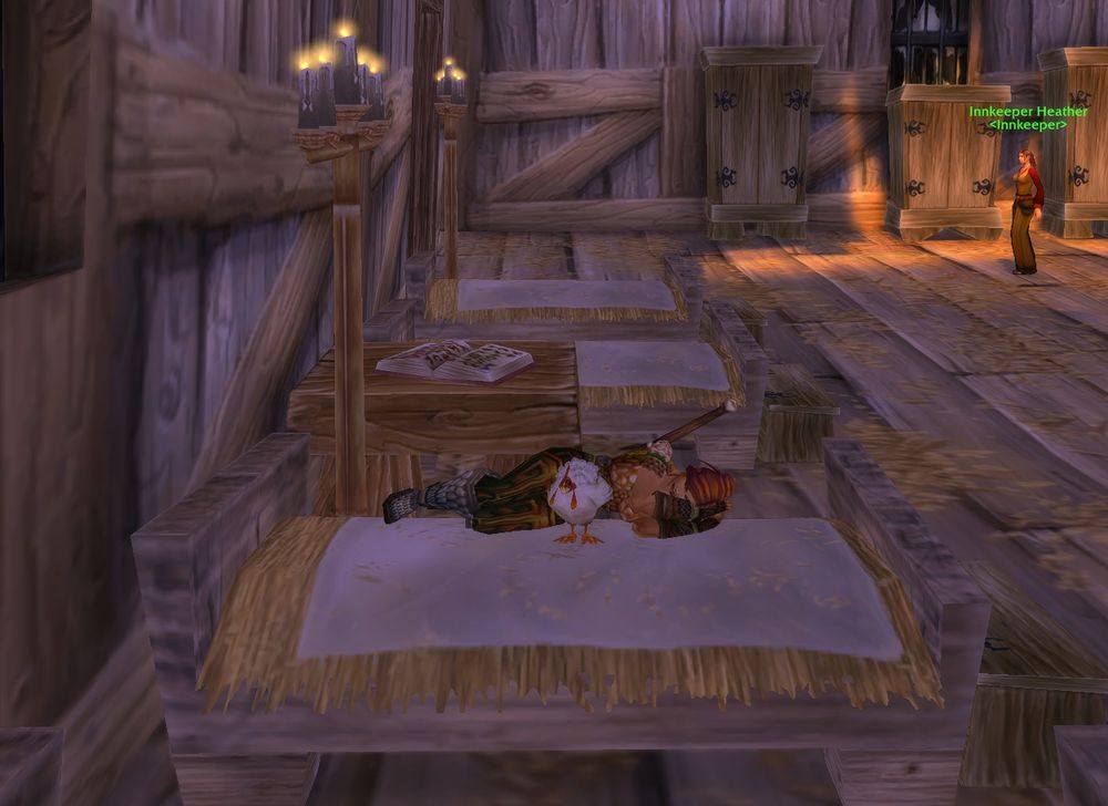 A screenshot from World of Warcraft Classic 20th Anniversary Edition. A human female warrior in a bed with her pet chicken in the inn at Sentinel Hill, Westfall.
