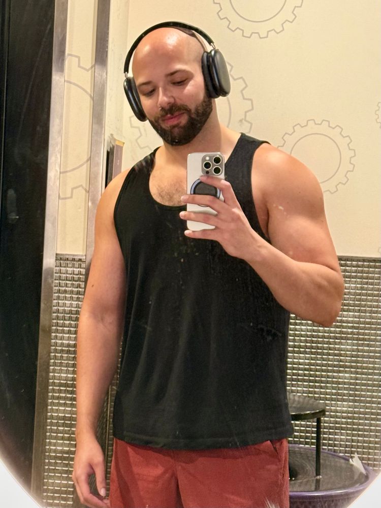 mirror selfie of me in a black tank top 