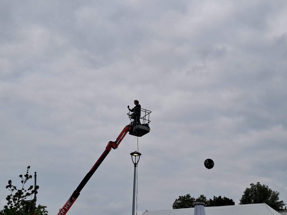 Festival leader Tim Isfort on a truck mounted crane taking pictures
