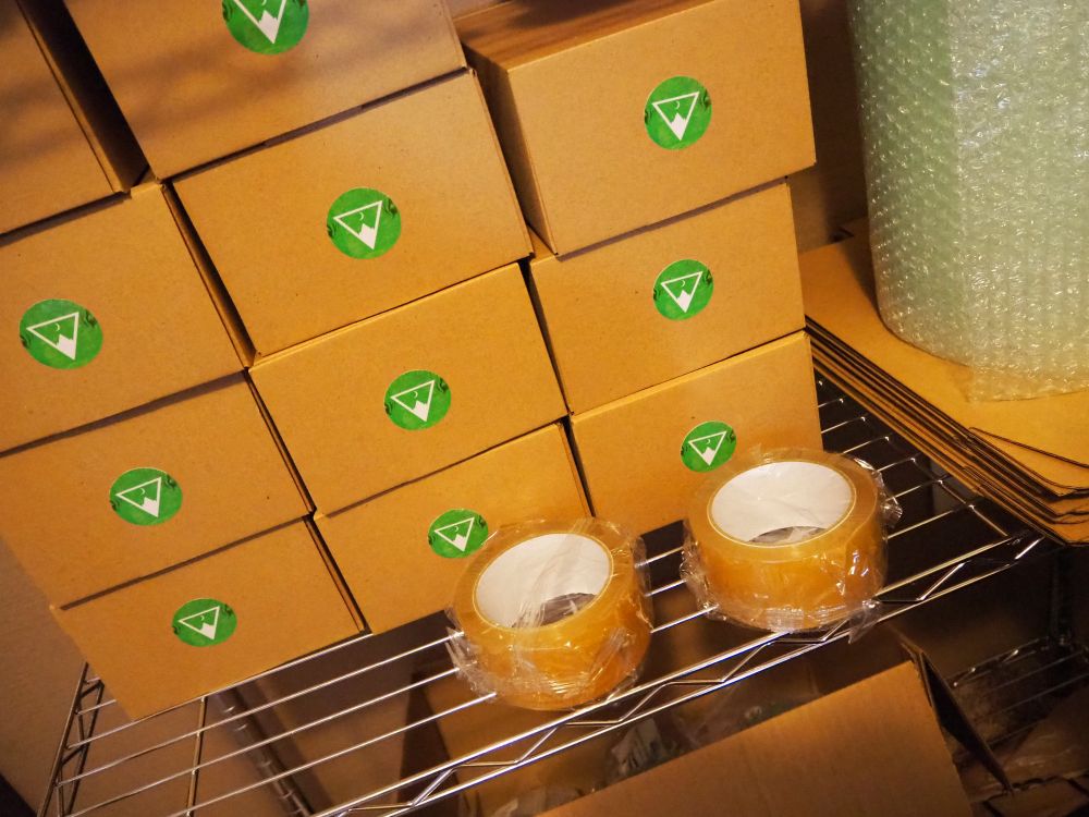 My shelf in my atelier with various jewelry making supplies in the background