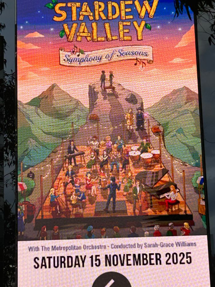 A picture of a digital billboard advertising the Stardew Valley Symphony of Seasons concert.