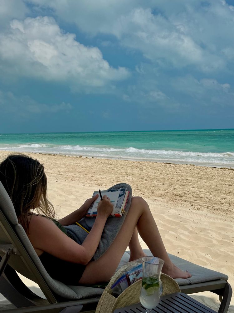 Woman (me) sketching with colored pencils on a beach in Mexico 

Initial thoughts on “urban” sketching: It’s as hard as I expected in all the ways I expected: The light changes with the movement of clouds and the sun. The waves are of course constantly moving. And I didn’t have as elaborate of a setup as I normally do. 

It was fun though! I experimented with a different medium than usual, colored pencils, since they’re a little easier to handle than paints without a large surface to work with. It’s kind of like taking a photo but better—you’re capturing a little time lapse rendition of a scene you’re in as a memento you can take with you. 

The beach spot was also fairly private—my partner took this photo—but I find that I personally don’t really like the feeling of being perceived, especially by strangers, when I’m making art. I did another colored pencil drawing on the plane (will share later) and I had to turn the little spotlight on and couldn’t shake the feeling of being watched over my shoulder. Maybe it’s something you get used to? No one approached me any of the times, and I was equally relieved and offended, lol. 