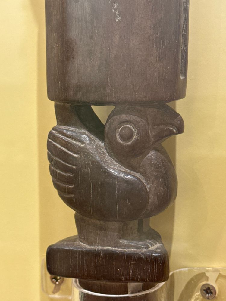 An excellent bird carving in dark wood, part of a larger piece