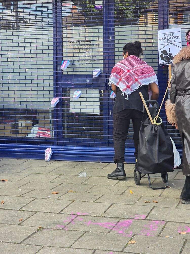 People putting coffins onto the door of Wes Streeting's office. 
