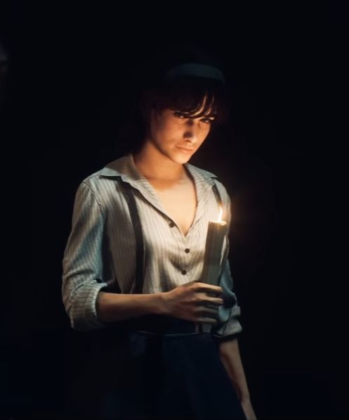 Auto-portrait de Cléa Dessendre à la bougie, en clair-obscur.