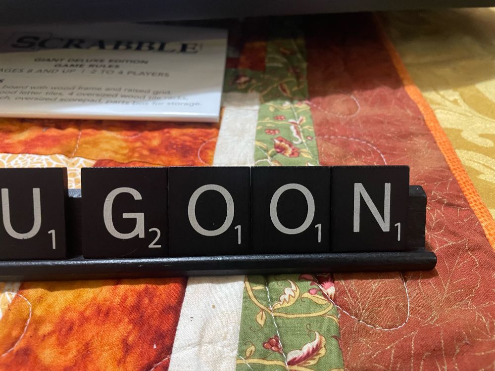 Scrabble letters spelling out “goon”