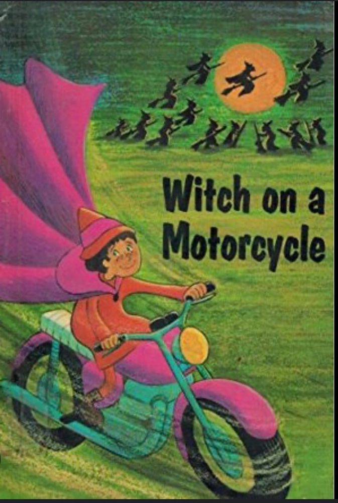 Photo of the book “Witch on a Motorcycle” The cover features a kid witch in a pink costume on a matching pink motorbike, with traditional witches on brooms in the background. 