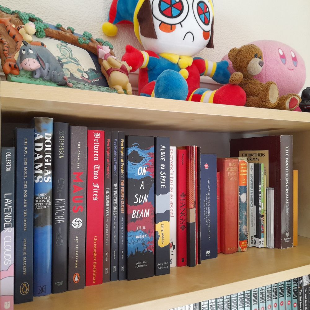 The top shelf, AKA; the random stuff and where the plushies go.

No real theme here. Its kind of the graphic novel shelf, but also the "big book" and misc shelf too. A couple vintage books, zines and anthologies...idk.