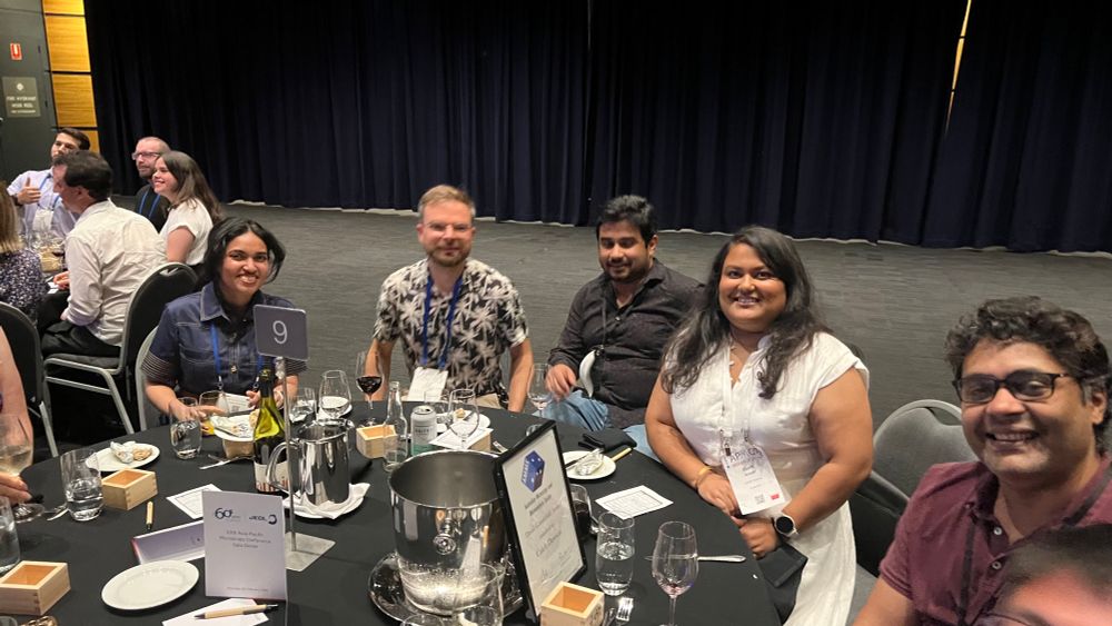 Some colleagues sitting around a dinner table