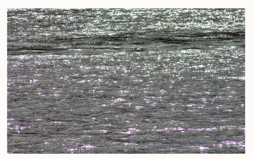 Fourteen images of light shimmering across waters of the River Thames.
