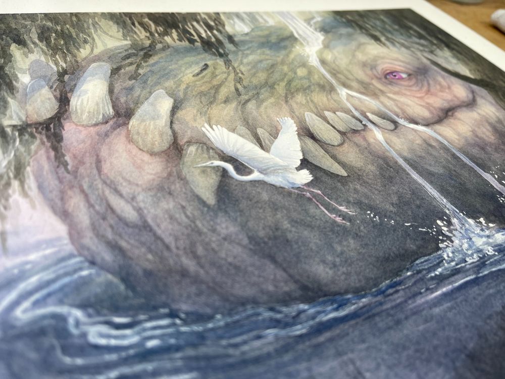 Angled view of a peaceful scene of a swamp, with greens, blues and purples, a tree in the foreground and the head of a huge dragon visible resting in the water. A white heron takes off next to the dragon and it's eye is open. 