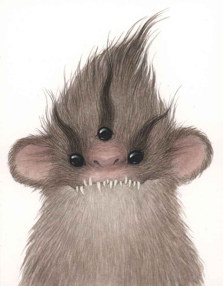 a small brown hairy creature with three black eyes, sticky out round fluffy ears and a very sharp toothed grin. 