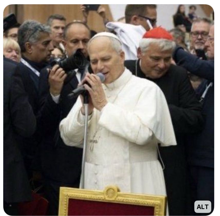 Pope with microphone singing Rapture by Blondie 