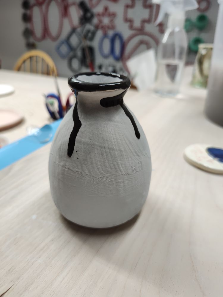 This is Amaco Celadon series in Jade, topped with a metallic gold rim. 