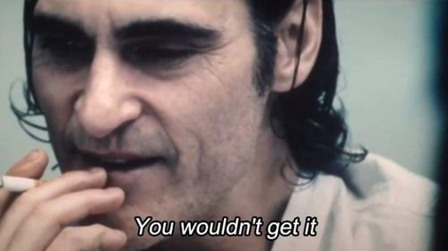 The Joker, smoking a cigarette, subtitle saying "you wouldn't get it"