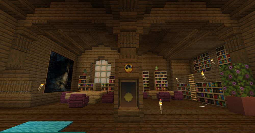 Main entrance of the library, a grandpa clock in the middle with some bookshelves and places to sit and read in the background.