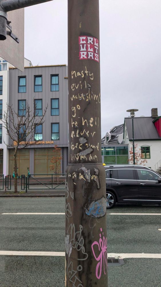A pole in Reykjavik with the text "nasty evil muslims go to hell never become(?) human again"