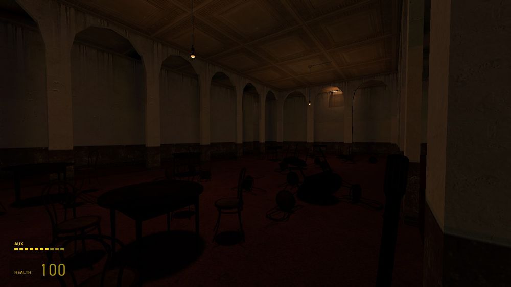 somewhat dark dining room, with orange lights