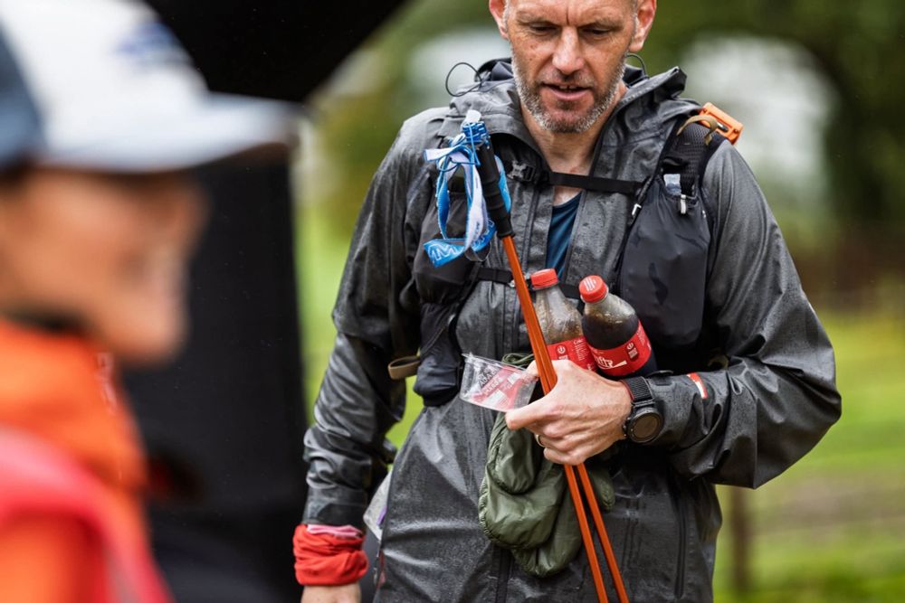 Arriving at the support point Carrying two bottles of Coca-Cola and an empty fruit pot which I'd eaten on the walk up the road from the co-op.