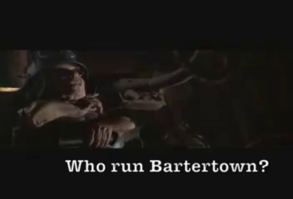 a man is sitting in a dark room with the words who run bartertown written on the bottom