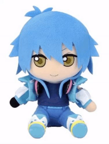 a stuffed toy with blue hair and yellow eyes is sitting on a white surface