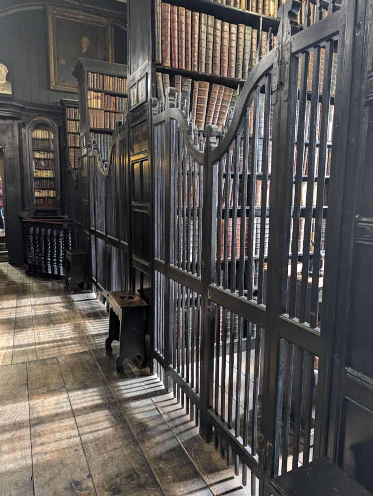 Very old bookshelves inside the medieval Chetham's Library 