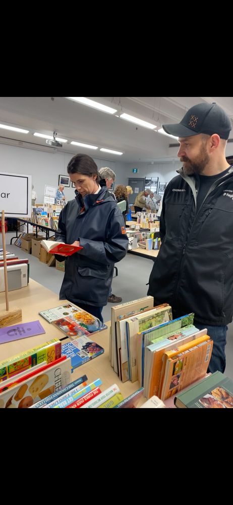 Emma Harrison looking at books at the book sale. 