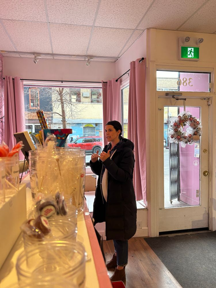 Emma Harrison talking to a local business at the First Friday Art Crawl
