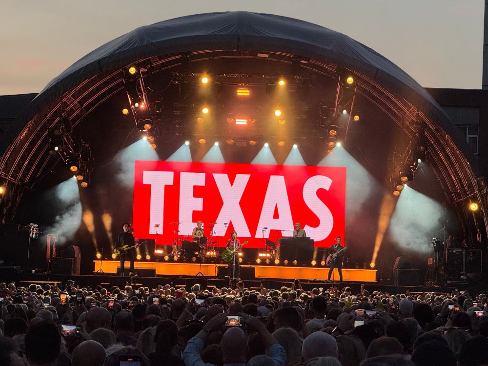 Texas band on stage. Custom House Square 