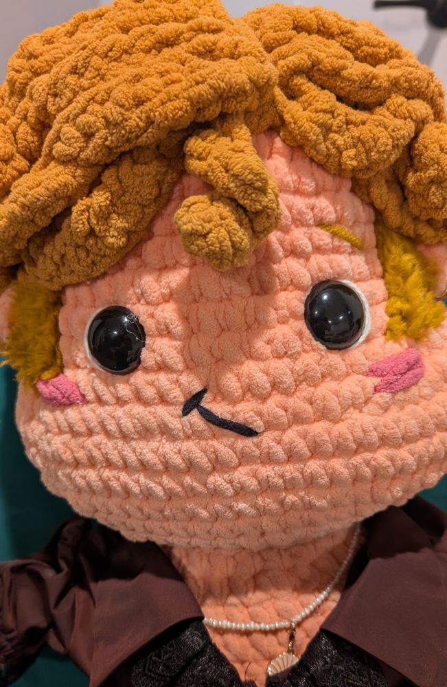 A close of up crochet Stede's face