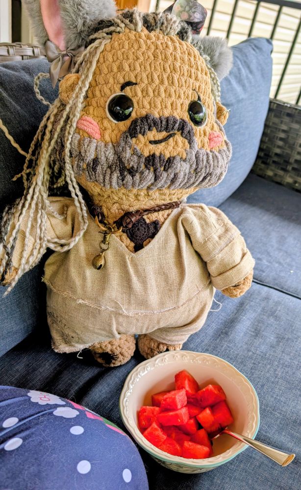 Crochet Ed teach with a bowl of watermelon 