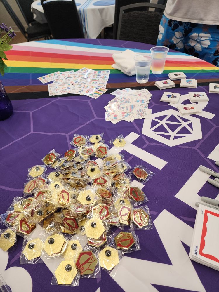 Gold CATAN logo pins