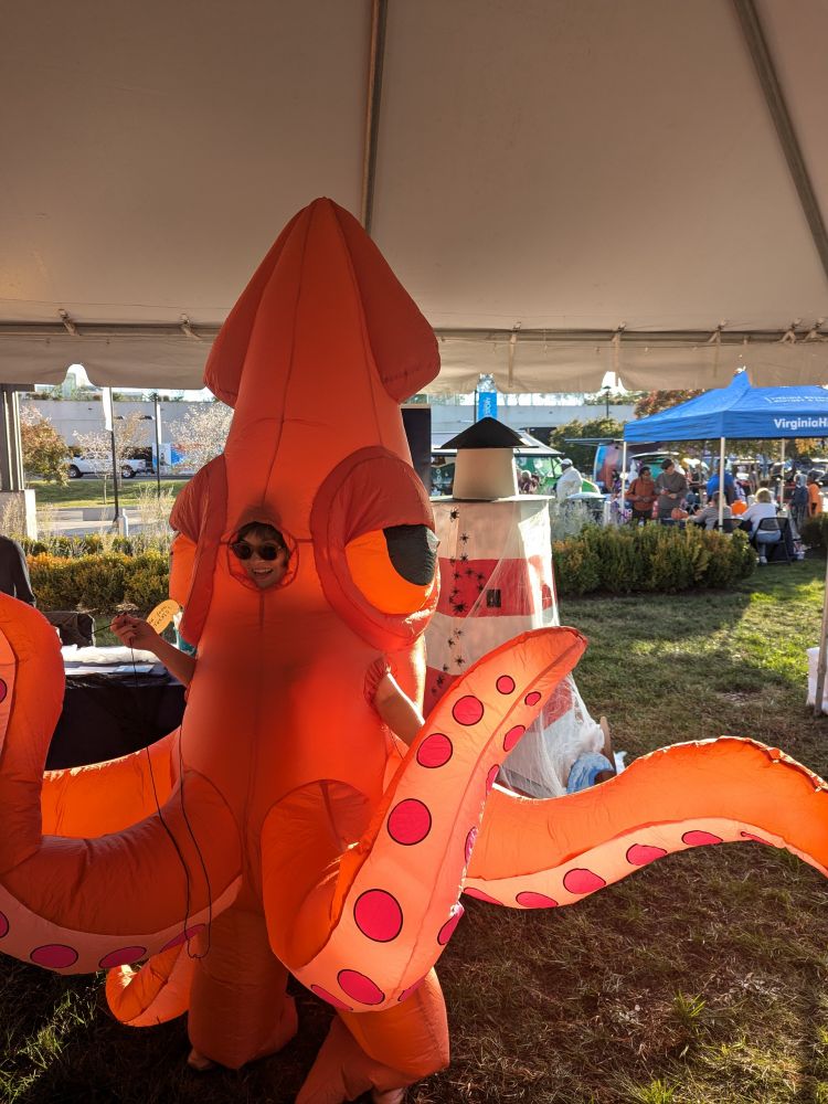 Me, in an inflatable squid. Giant. Orange.