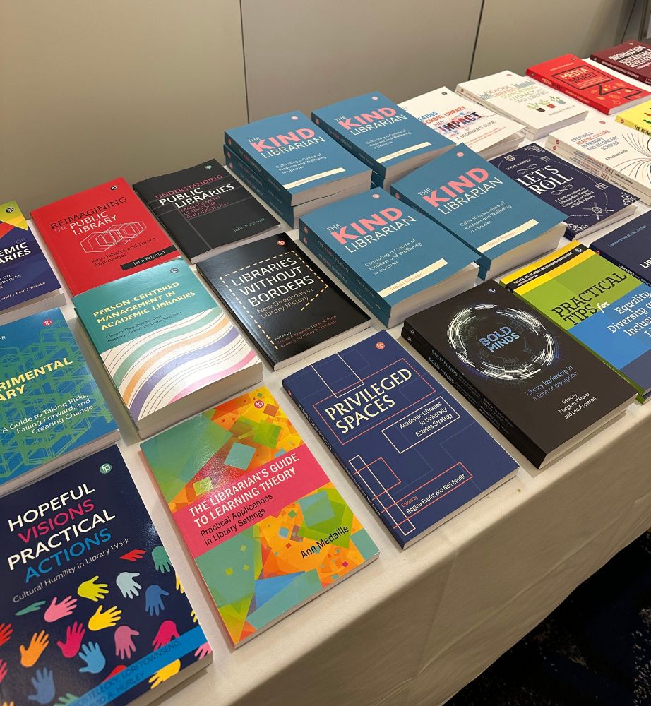 Picture of the Facet stand, featuring our books.