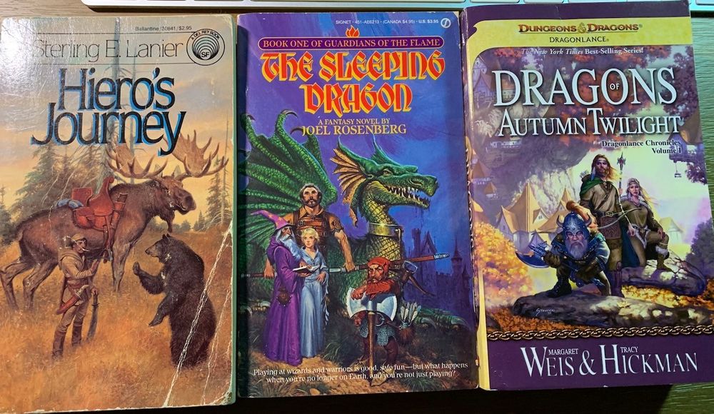 Covers of Hiero's Journey by Sterline E. Lanier, The Sleeping Dragon by Joel Rosenberg, and Dragons of Autumn Twilight by Margaret Weis & Tracy Hickman
