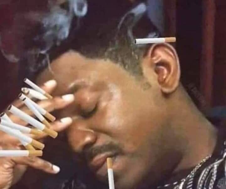 The Mekhi Phifer cigarette meme except an entire carton worth of cigarettes has been photoshopped onto his hand, with one also photoshopped onto his lip and for reasons I don’t understand a lit one tucked behind his ear