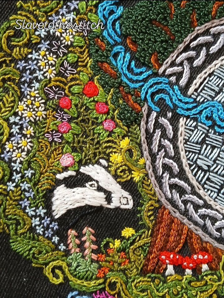 Embroidered badger amongst the flowers