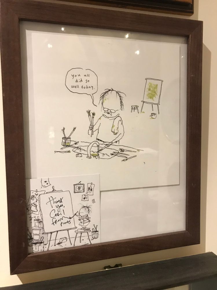 A framed cartoon by Pants, showing an old artist dude whose name I can’t remember cleaning his paintbrushes at the sink and telling them amiably, ‘you all did so well today’. In the background is an easel with a splodgy looking painting on it.