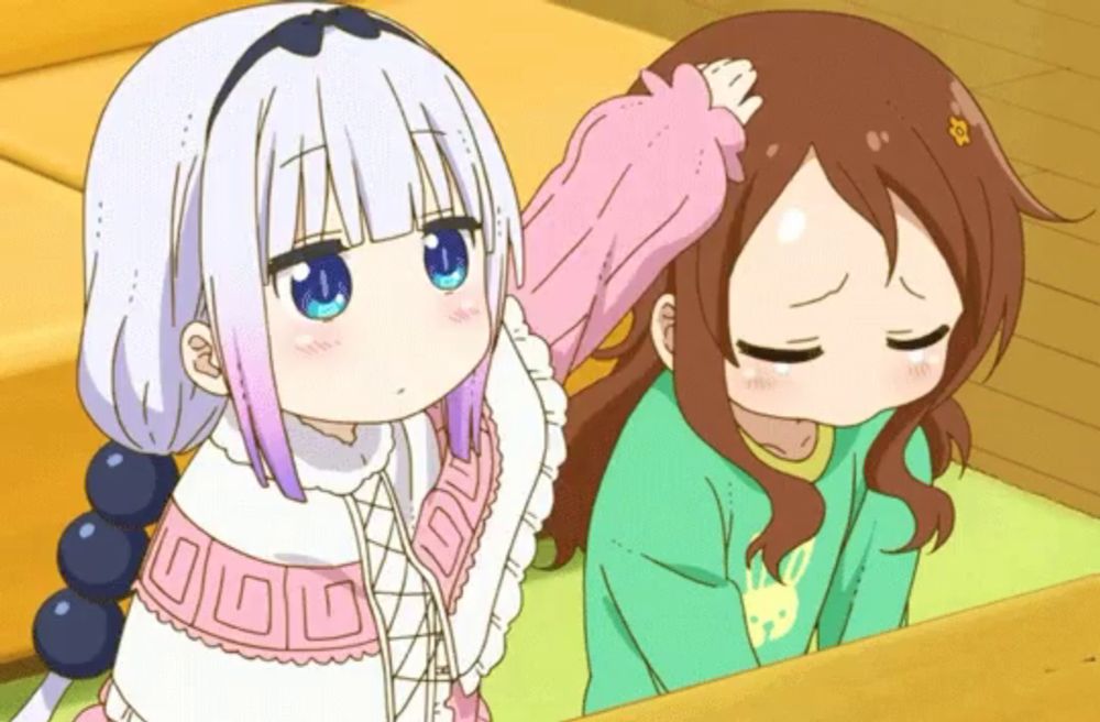 two anime girls are standing next to each other and one is petting the other 's hair