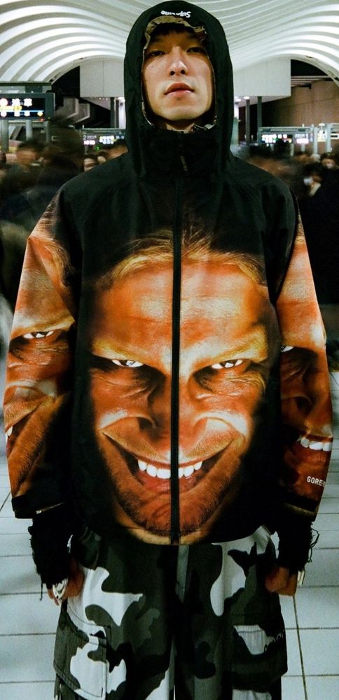 A perfectly normal colour photo of Aphex Twin's face. Printed on the front of a hoodie.