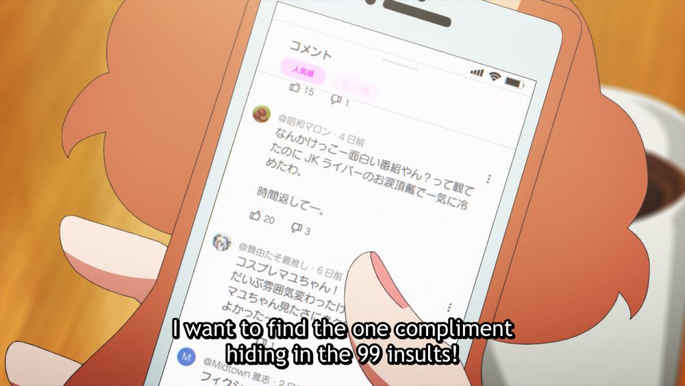 anime girl scrolling youtube comments on her phone: "I want to find the one compliment hiding in the 99 insults!"
