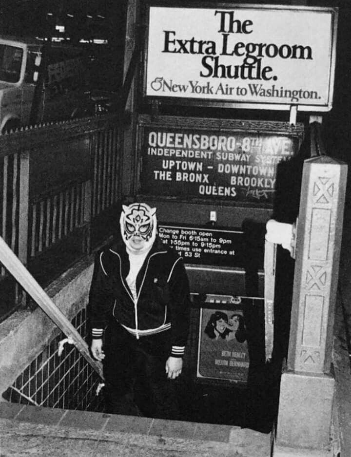 A photo of guy in a tiger luchador mask and a track suit, coming up the stairs from the subway in what appears to be 1970s New York City. I got this from Pinterest, and I don't know more about it than that.