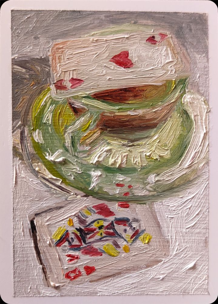 A painting of a green glass teacup and saucer with an ace of hearts playing card on the top. Below the saucer is a queen of hearts card.
