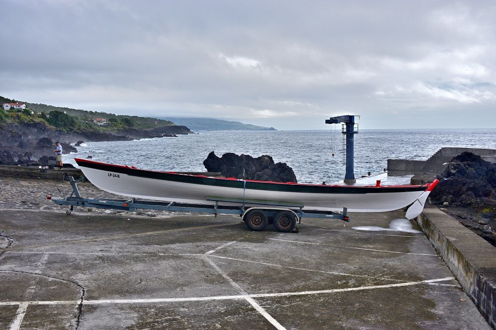 The dory from the side looking down the coastline. Just in front of the dory a surf fisherman had just caught a Sargo, also called a Sea Bream.