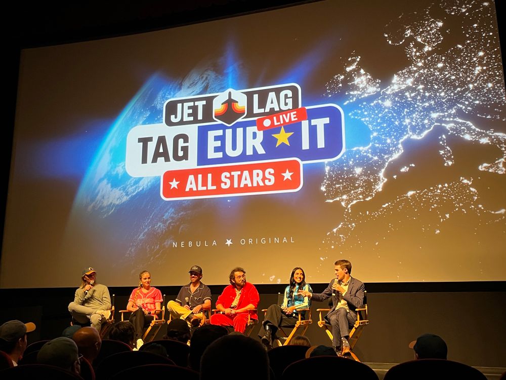 Sam, Toby, Brian, Ben, Michelle, Adam on stage during the live taping of the Layover podcast. 