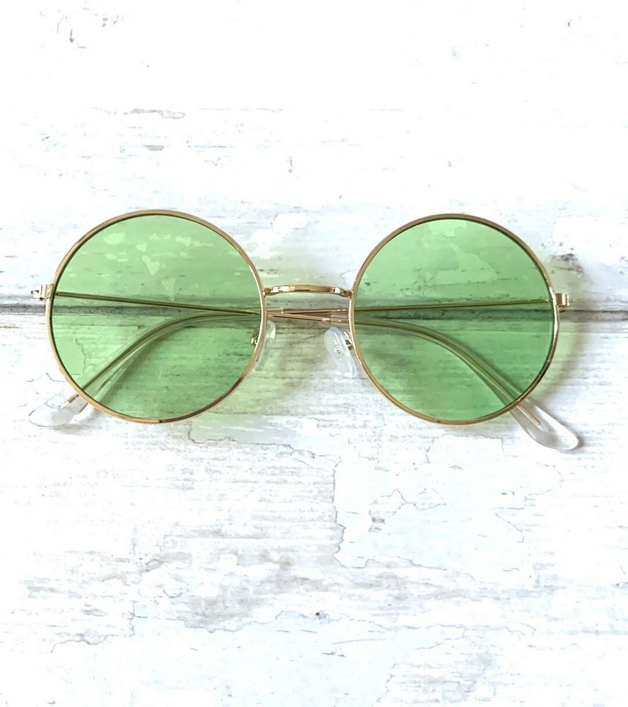 A pair of glasses with green tinted lenses.