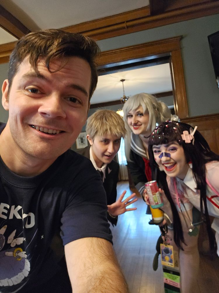 Rob with several cosplayers from the Danganronpa series. 