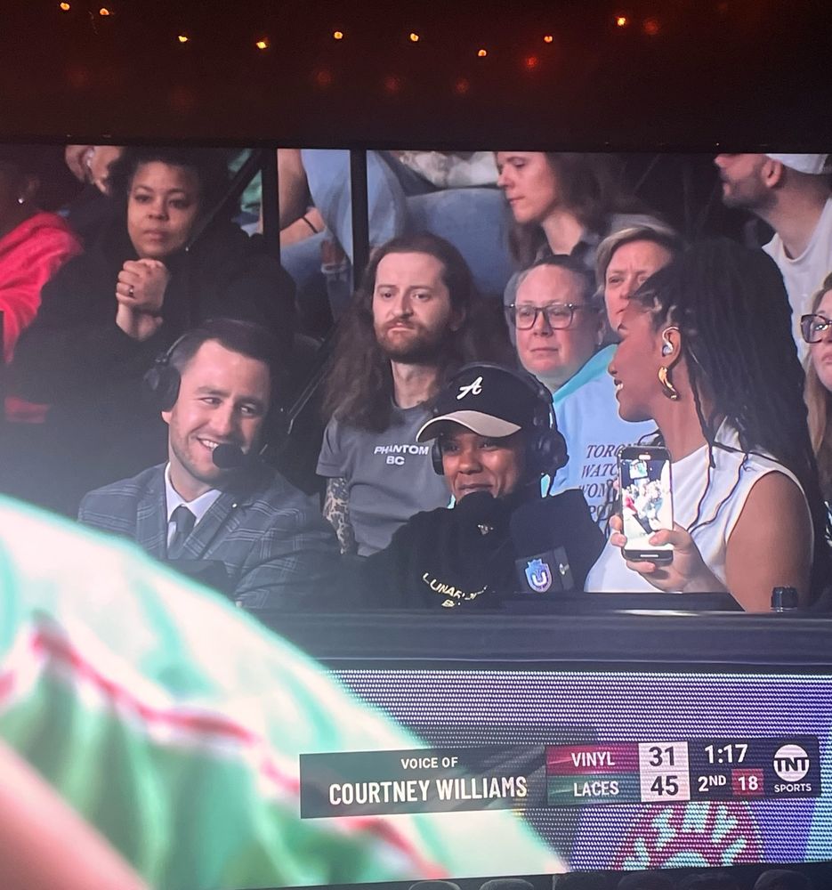 Courtney Williams doing commentary during the Laces-Vinyl basketball game.