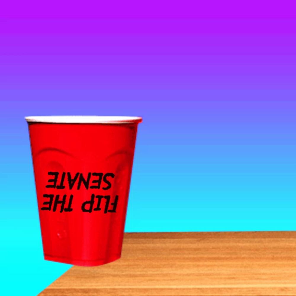 a red cup that says flip the senate sits on a table